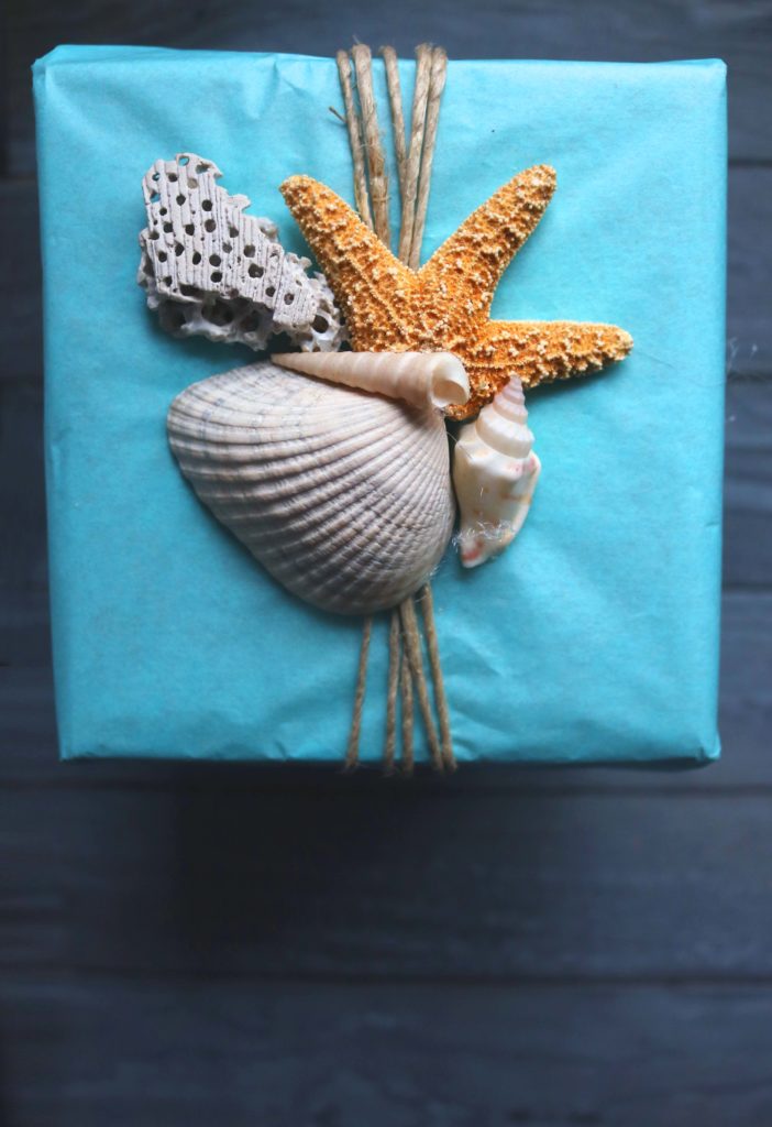 Use seashells instead of a bow for wrapping your gifts this year, plus other ideas for upcycled and natural wrappiong.