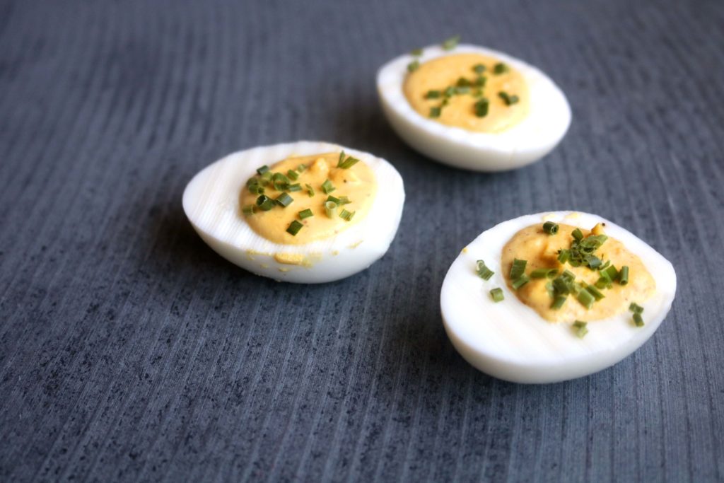 A creative deviled eggs recipe that incorporates sparkling wine with bright green chives. Yum! Perfect for Easter or Ostara.