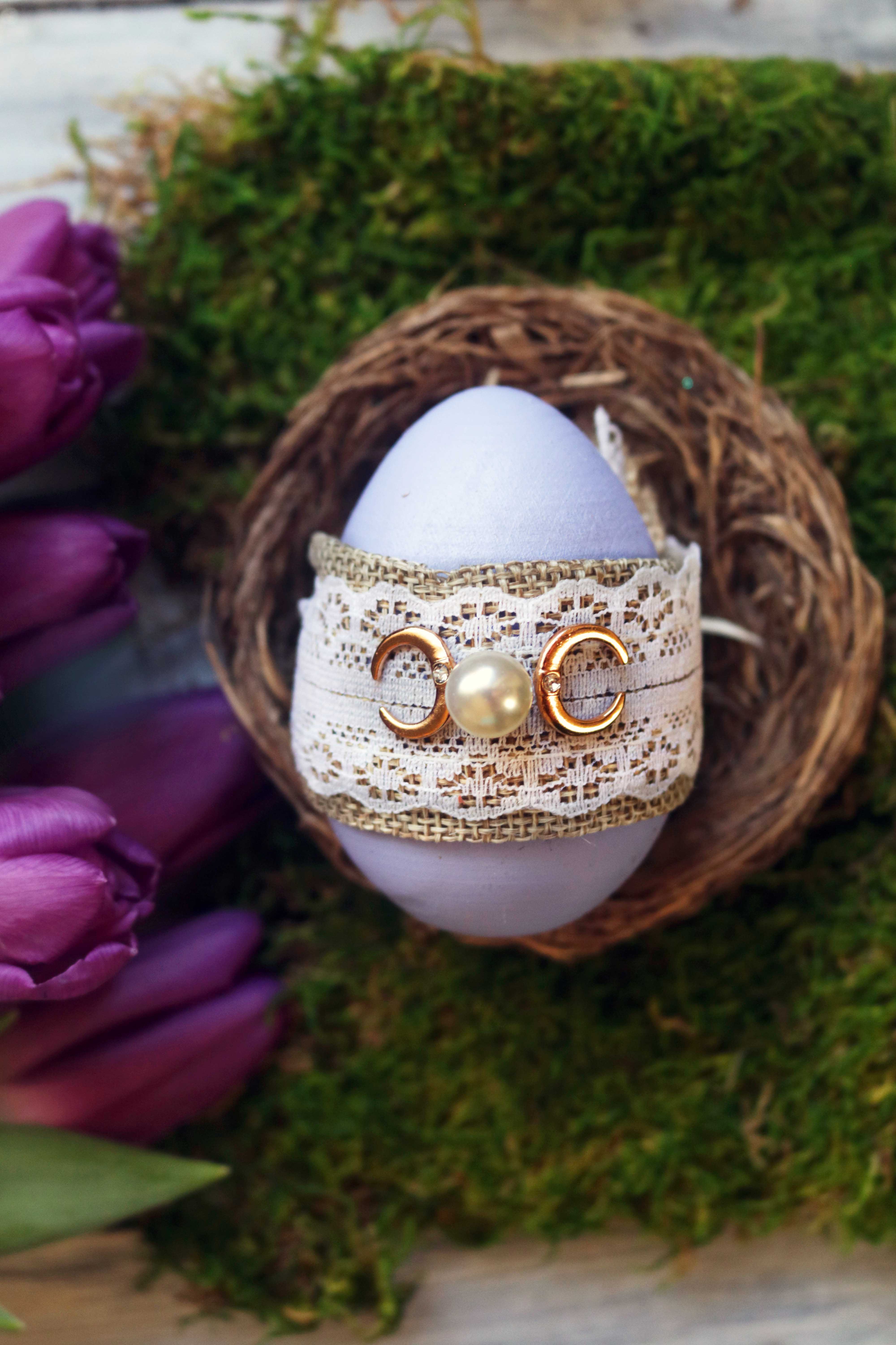 Ostara wishing egg spell with triple moon motif.