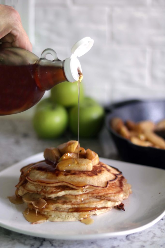 Spicy gingerbread pancakes with a warm maple syrup drizzle.