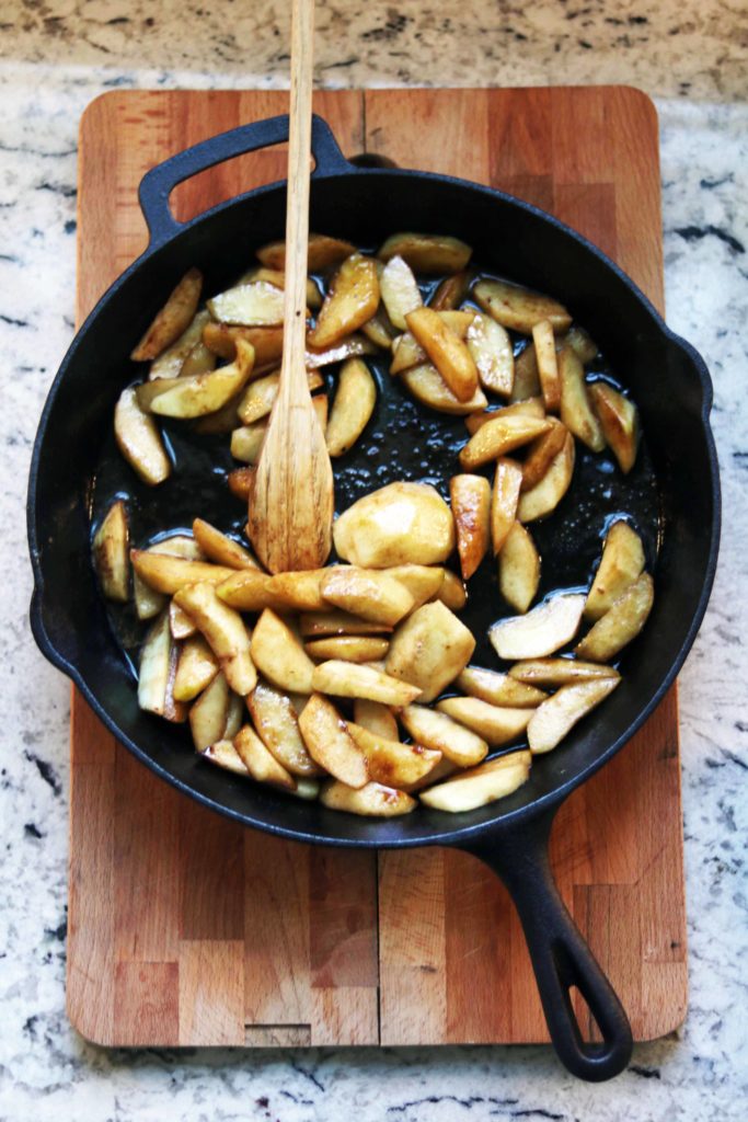 Hot fried cinnamon apples in a cast iron pan. Yum, so cozy for fall!