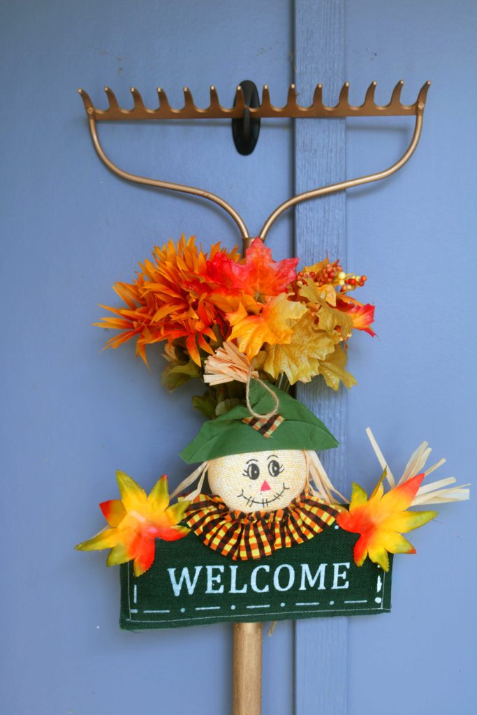 Upcycled yard tool turned into autumn decoration.