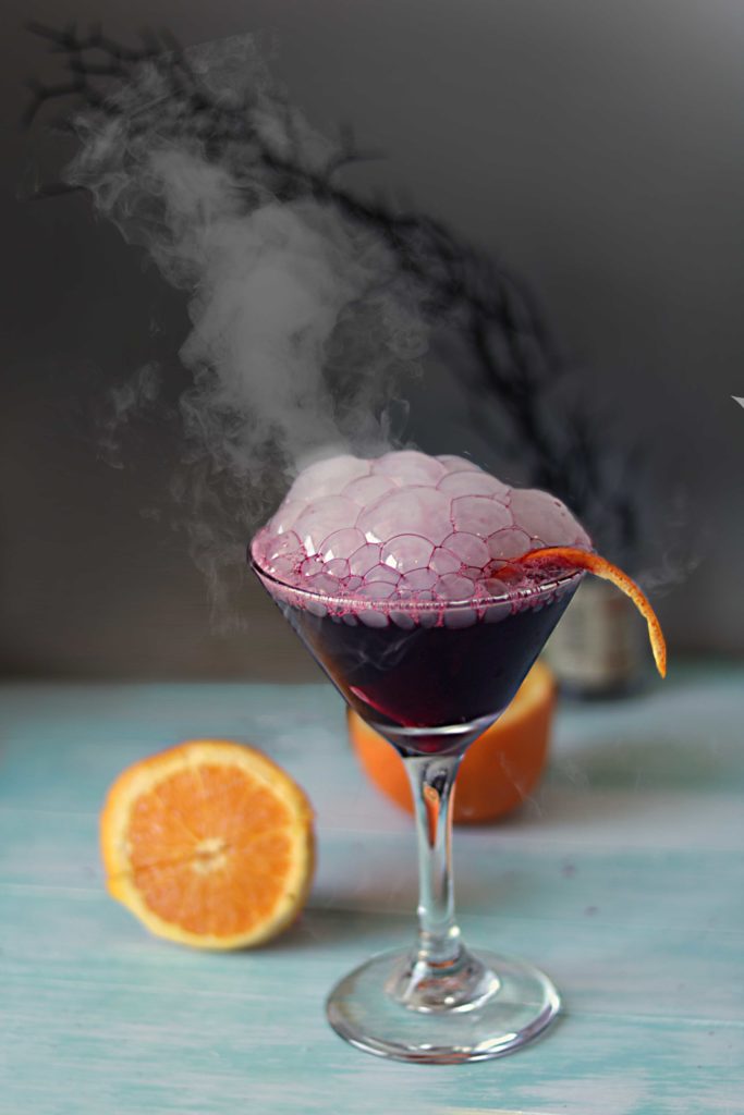 Bloody witch's brew black magic martini. Perfect for Samhain or Halloween.