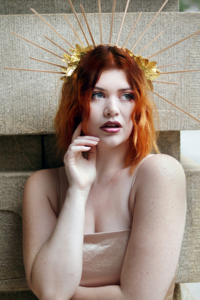 Witchy fashion trends: Try wearing a spiky gold crown for the Winter Solstice.