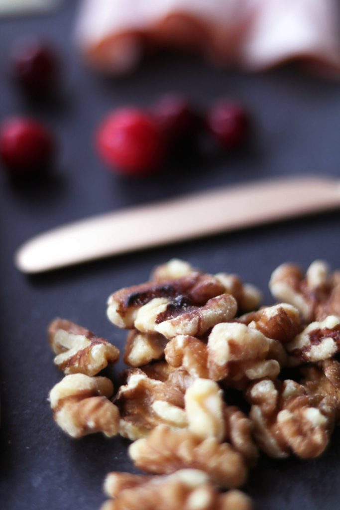 Walnuts on an artisan cheese board for fall or Thanksgiving.