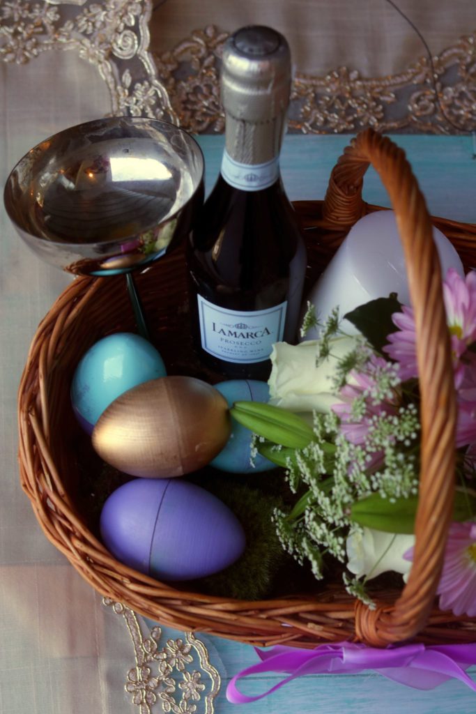 Prosecca, a vintage chalice, hand-painted wooden eggs and fresh flowers make this spring gift basket a beautiful way to celebrate the Equinox.