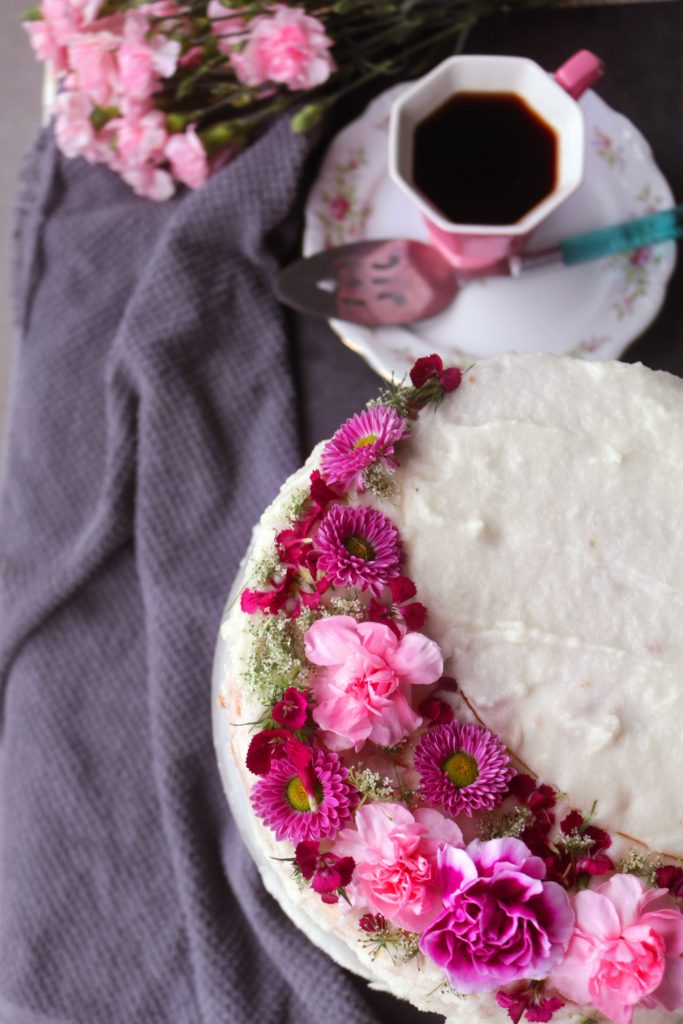 Pink Moon Champagne Cake with real pink flowers and sparkling wine.