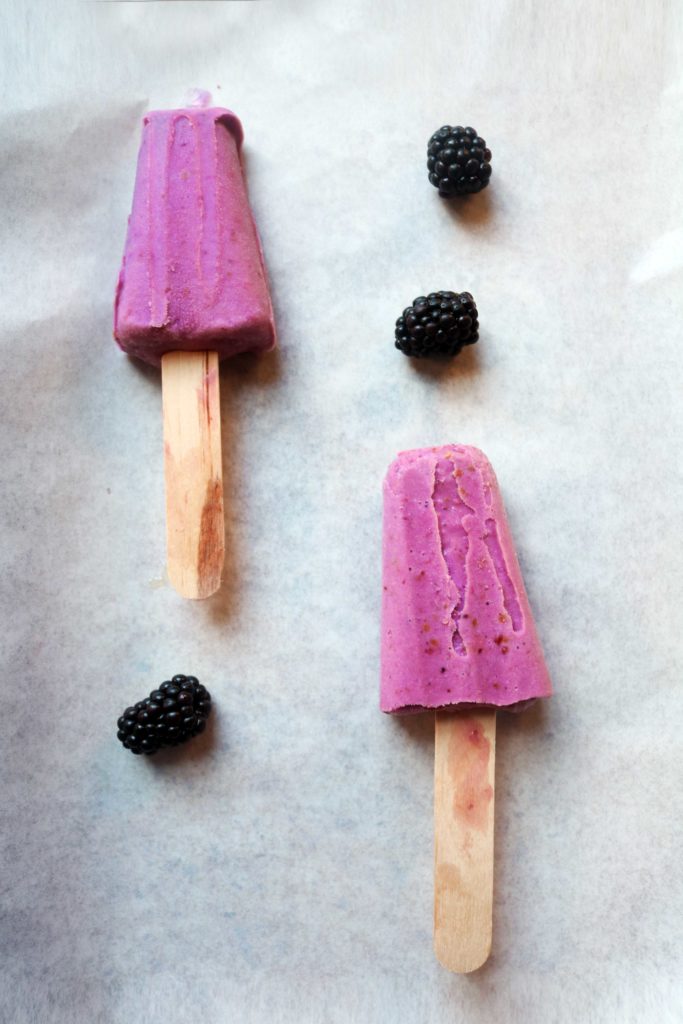 Easy, DIY blackberry moon milk ice pops with ashwagandha powder.