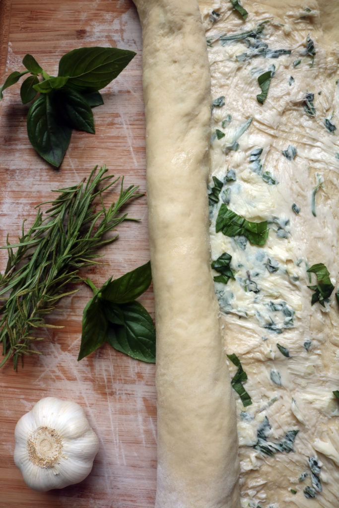 Rolling technique to make herbal swirl bread.