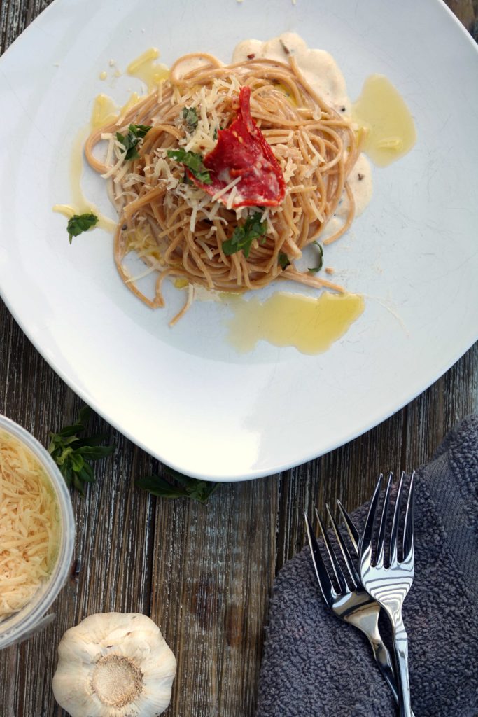 A kitchen witch's Imbolc recipe for winter cream pasta with white wine and tender herbs.