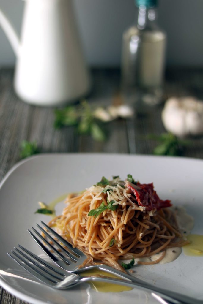 Imbolc creamy winter pasta with herbs and sundried tomatoes. 