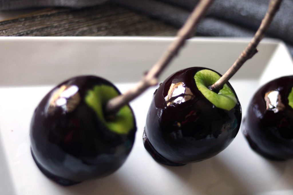 Create a little magic at your Samhain, Halloween or Snow White themed party with these black magic "poison" candle apples. Super easy and fun to make.