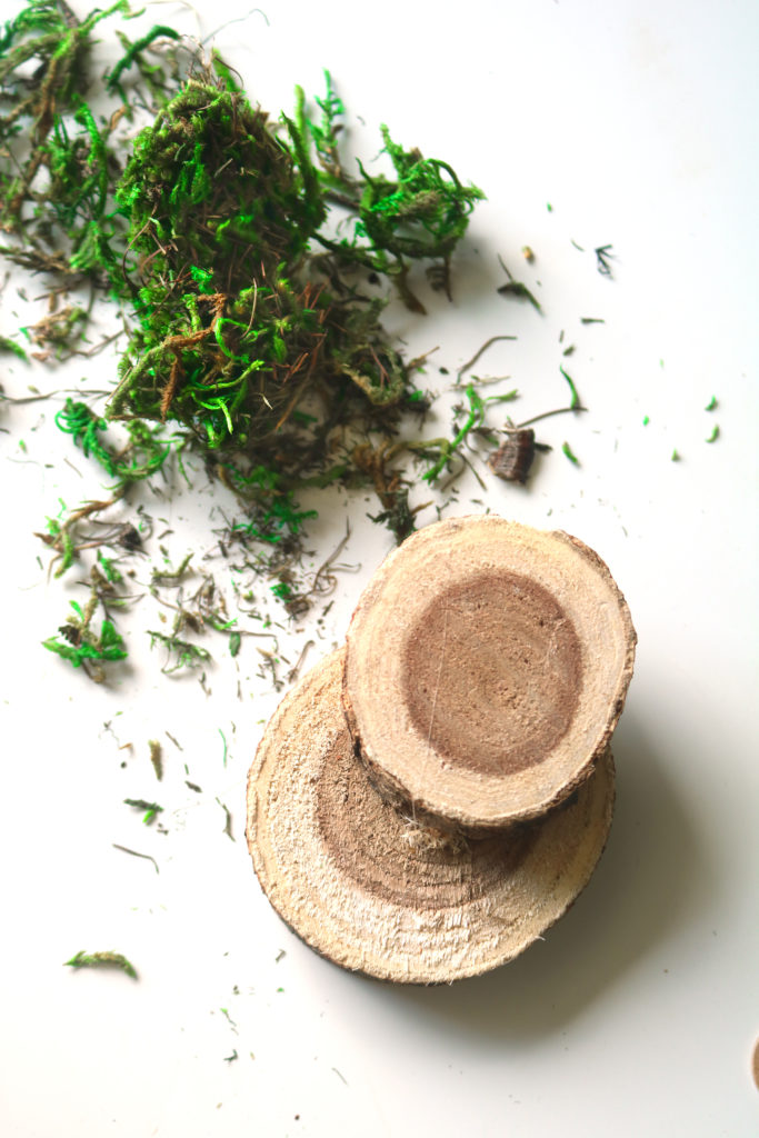 Using natural wood slices to make steps for a fairy door.