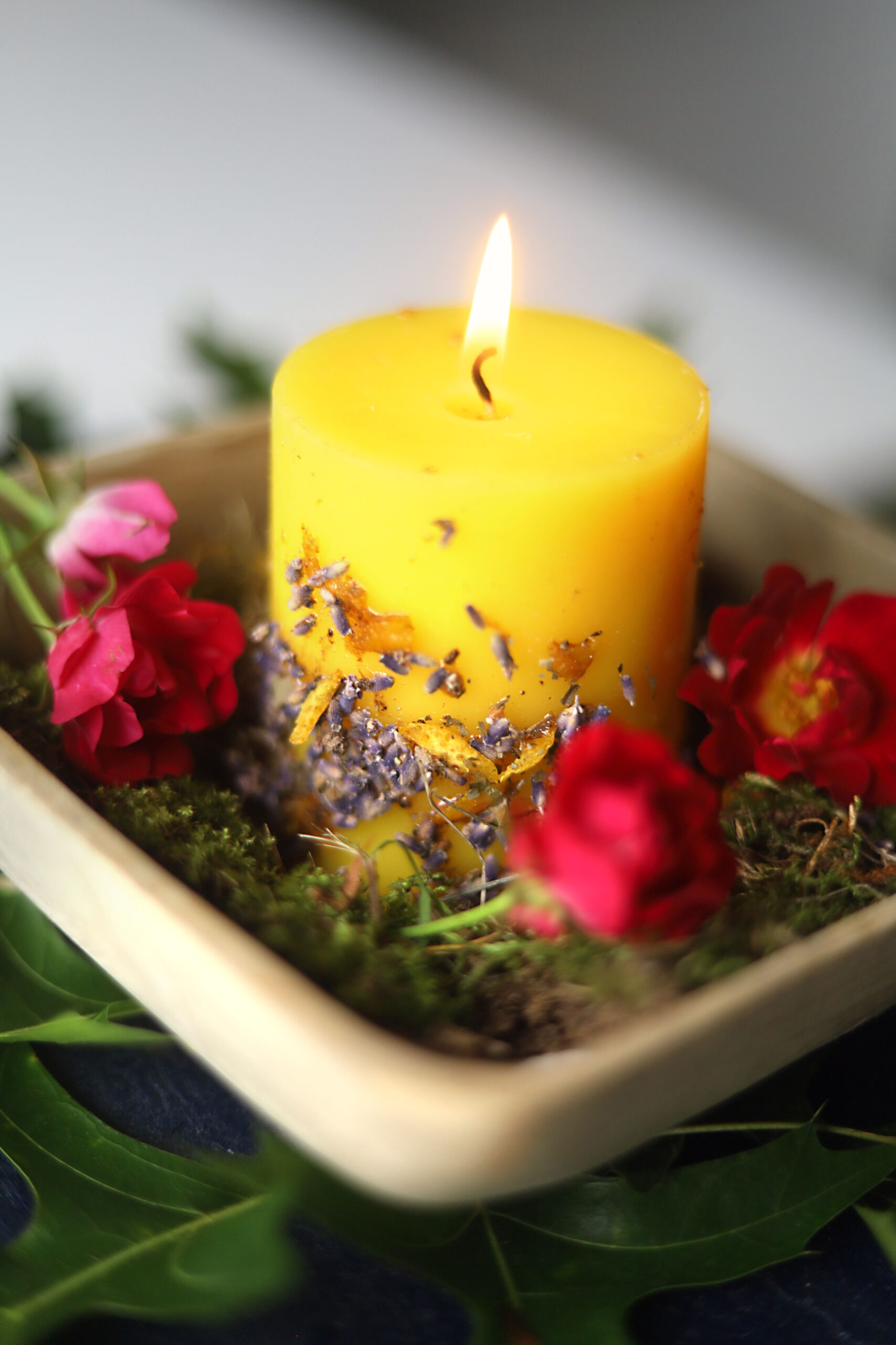 Gorgeous, easy-to-make Summer Solstice altar candle or ritual candle for litha. Natural ingredients like hand-gathered moss, flowers, honey, and oak leaves.